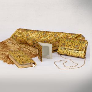 a brocade clutch shawl and purse with a matching mirror and card holder