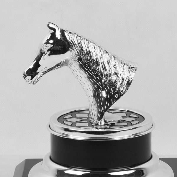 a silver-plated brass horse head trophy on a black and gold base, symbolizing achievement and elegance