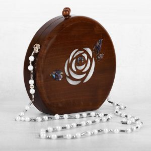 Handcrafted wooden box with intricate floral inlays and an elegant beaded handle.