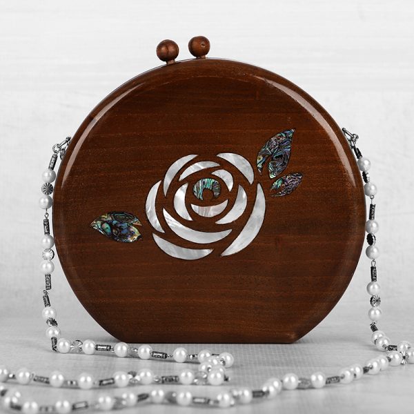 Handcrafted wooden box with intricate floral inlays and an elegant beaded handle.