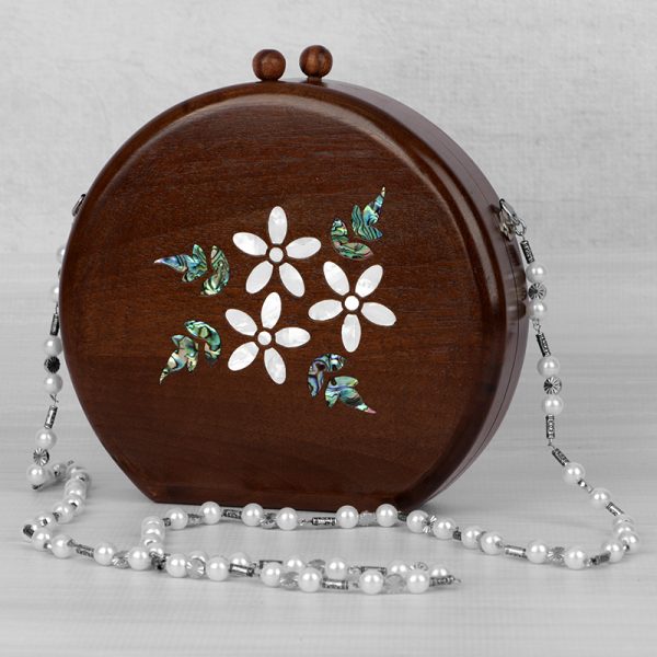 Handcrafted wooden box with intricate floral inlays and an elegant beaded handle.