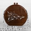 Handcrafted wooden box with intricate floral inlays and an elegant beaded handle.