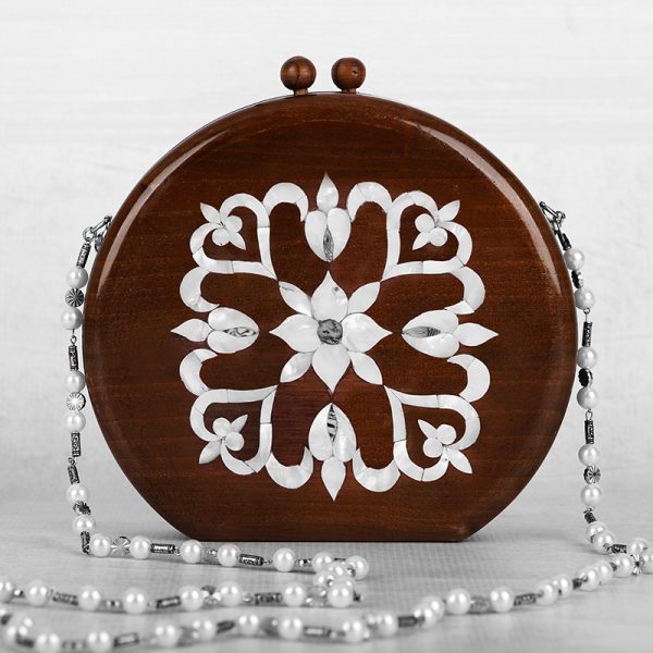 Handcrafted wooden box with intricate floral inlays and an elegant beaded handle.