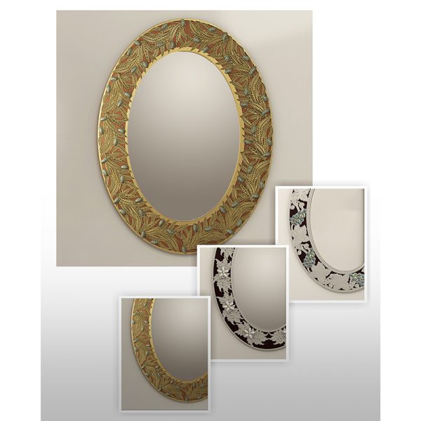 An oval wood and brass wall mirror inlayed with mother-of-pearl