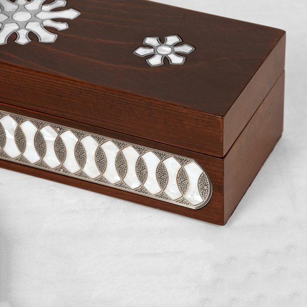 A wooden handmade box inlayed with silver and mother-of-pearl