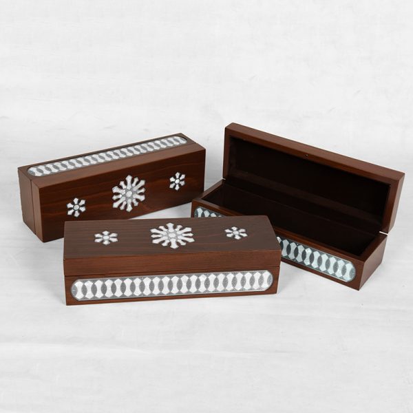 A wooden handmade box inlaid with silver and mother-of-pearl "