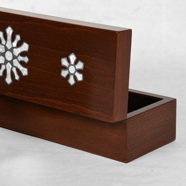 A wooden handmade box inlayed with silver and mother-of-pearl